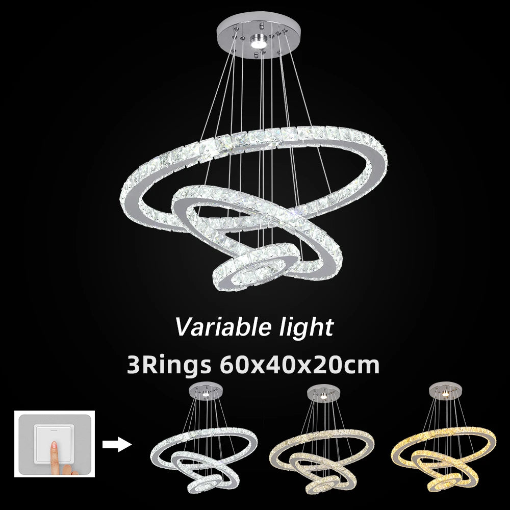 Chandelier with three rings on a black background, featuring text about variable light and dimensions.