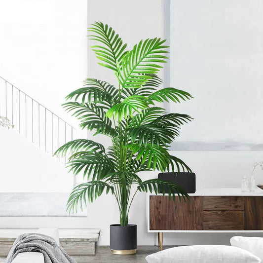 Tall green potted plant in a modern living room setting