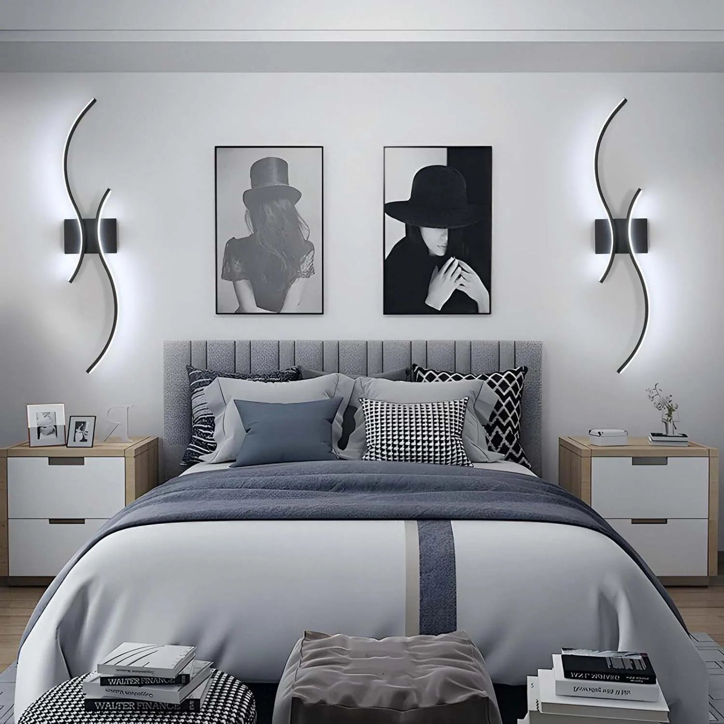 Modern bedroom with gray bedding, nightstands, and wall art.
