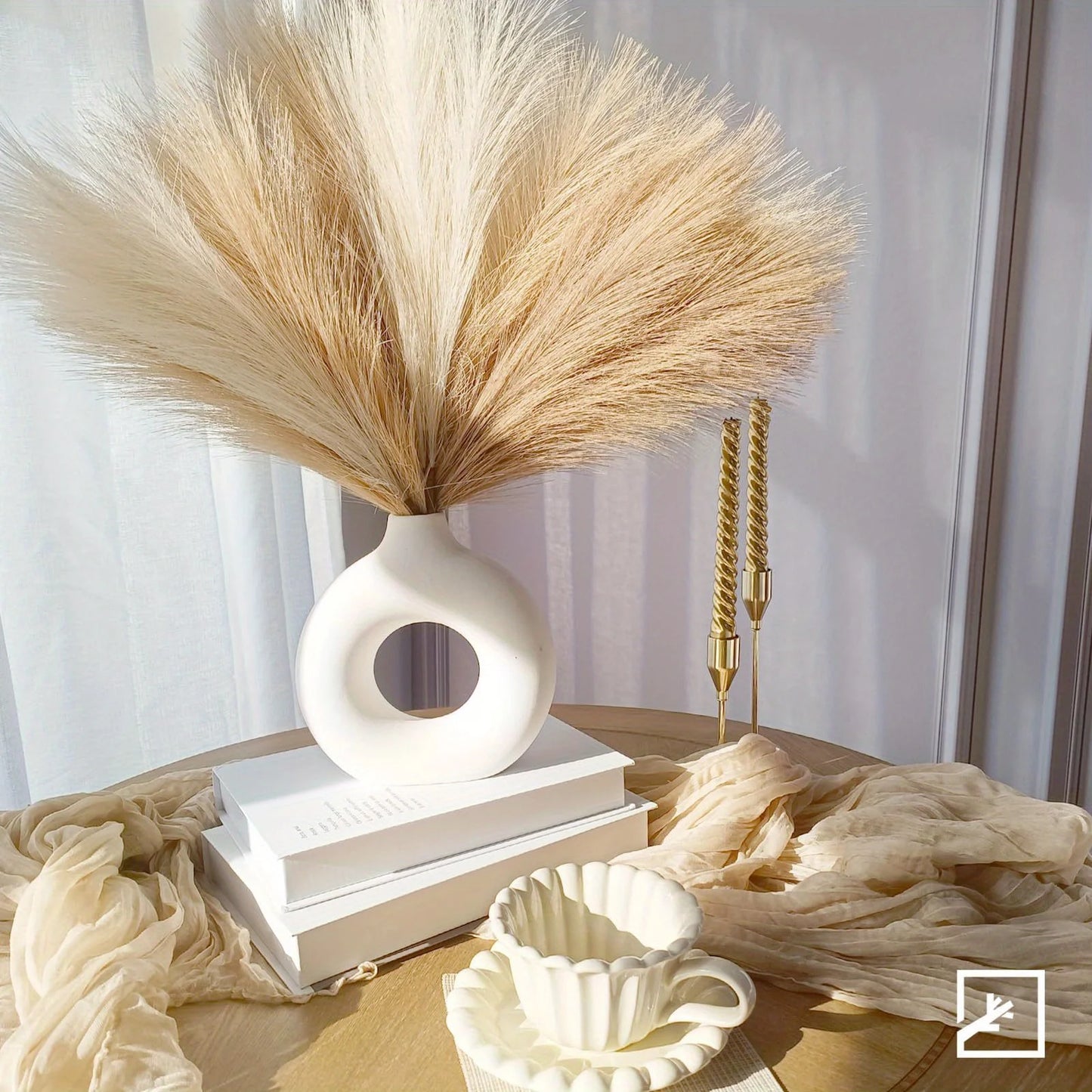 Decorative vase with dried pampas grass on a table with soft lighting