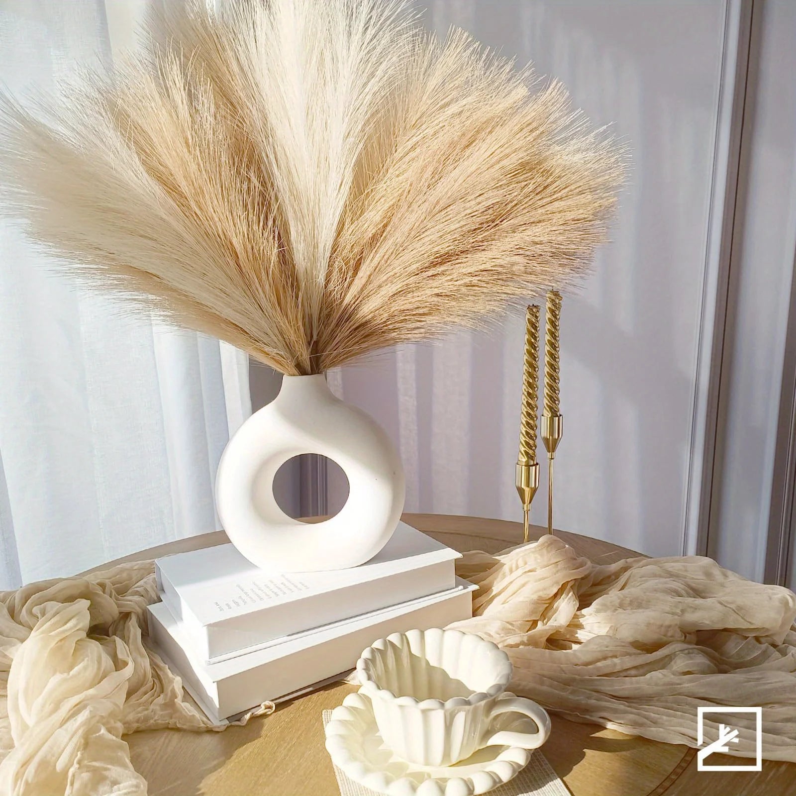 Decorative vase with dried pampas grass on a table with soft lighting